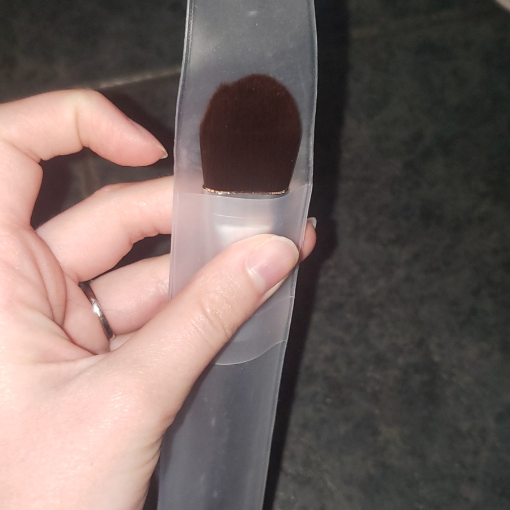 Liquid foundation and large concealer brush makeup